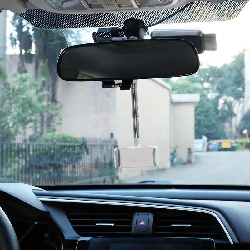 ABS plastic phone bracket mounted on vehicle rearview mirror holding smartphone