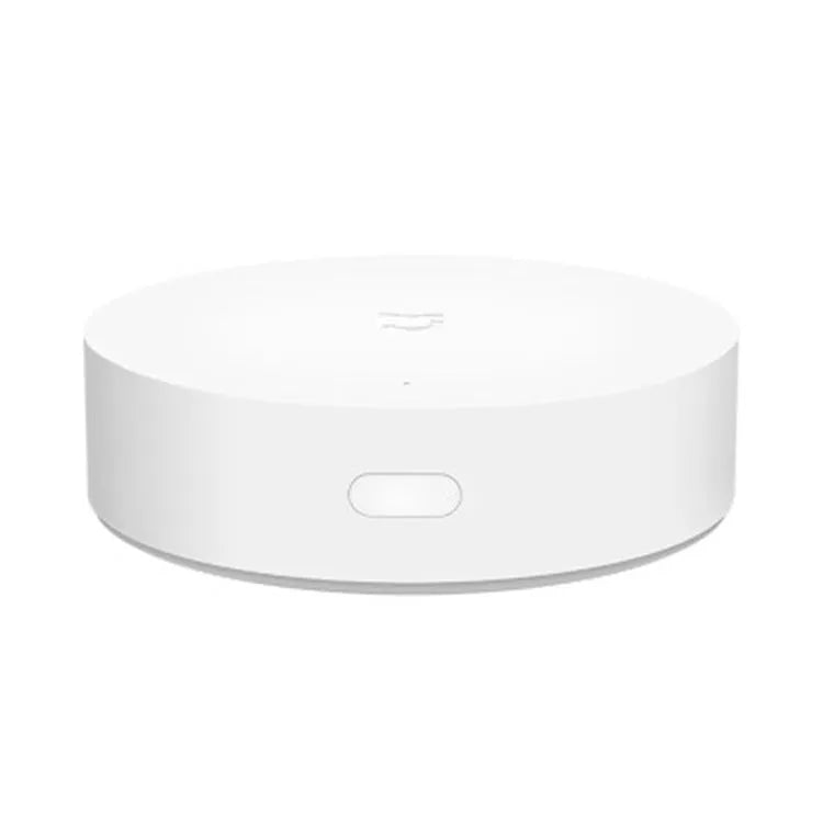 White circular Xiaomijia smart home gateway wall switch with UK plug for wireless device control