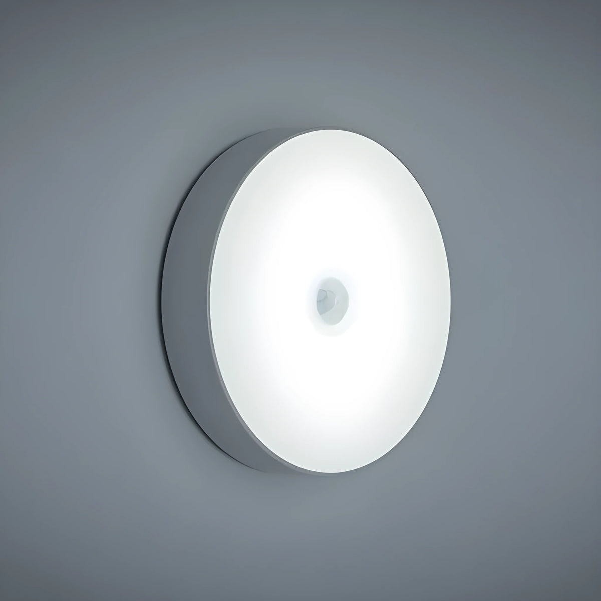 USB rechargeable motion sensor night light in beige or white, 86mm diameter, with adhesive tape