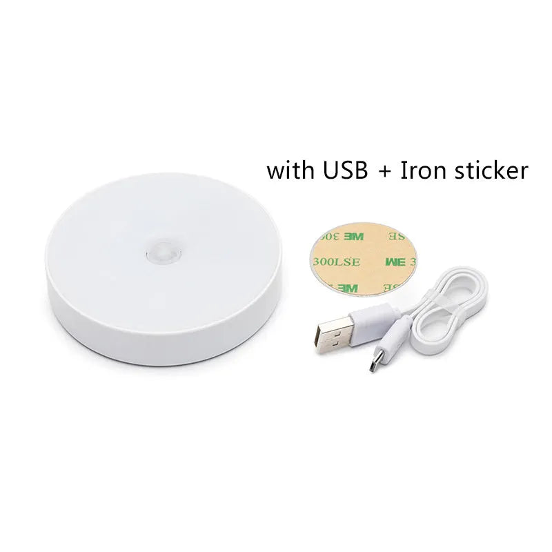 USB rechargeable motion sensor night light in beige or white, 86mm diameter, with adhesive tape