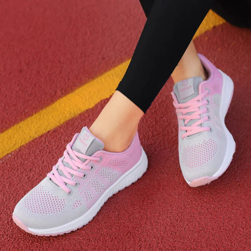 Women's white high-top casual sneakers with net-style upper, cross strap, and back lacing on a sticky rubber sole.