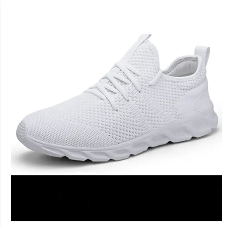 Men's black and white mesh sneaker with lace-up closure and round toe on a PVC sole.