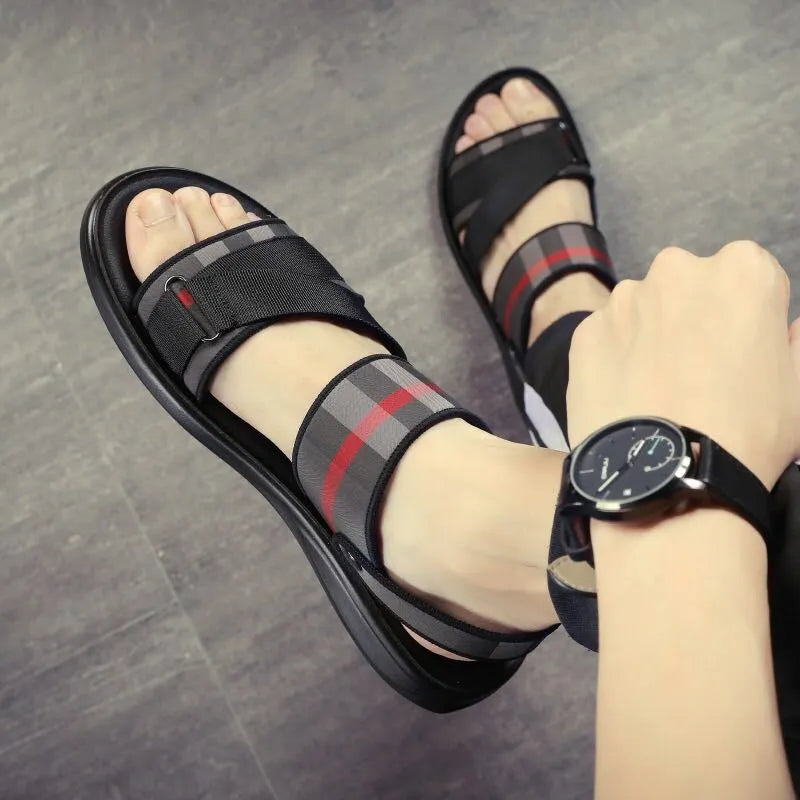 A pair of youth leisure sandals with a blue Lycra upper and a light polyurethane sole