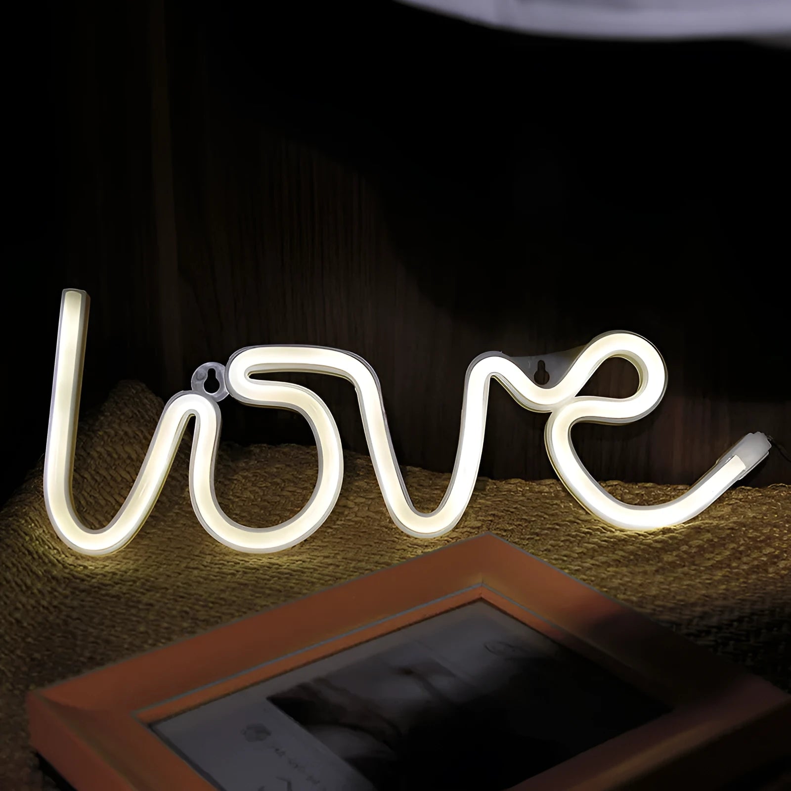 Pink and warm white LED neon love sign light for indoor wedding and party decorations.