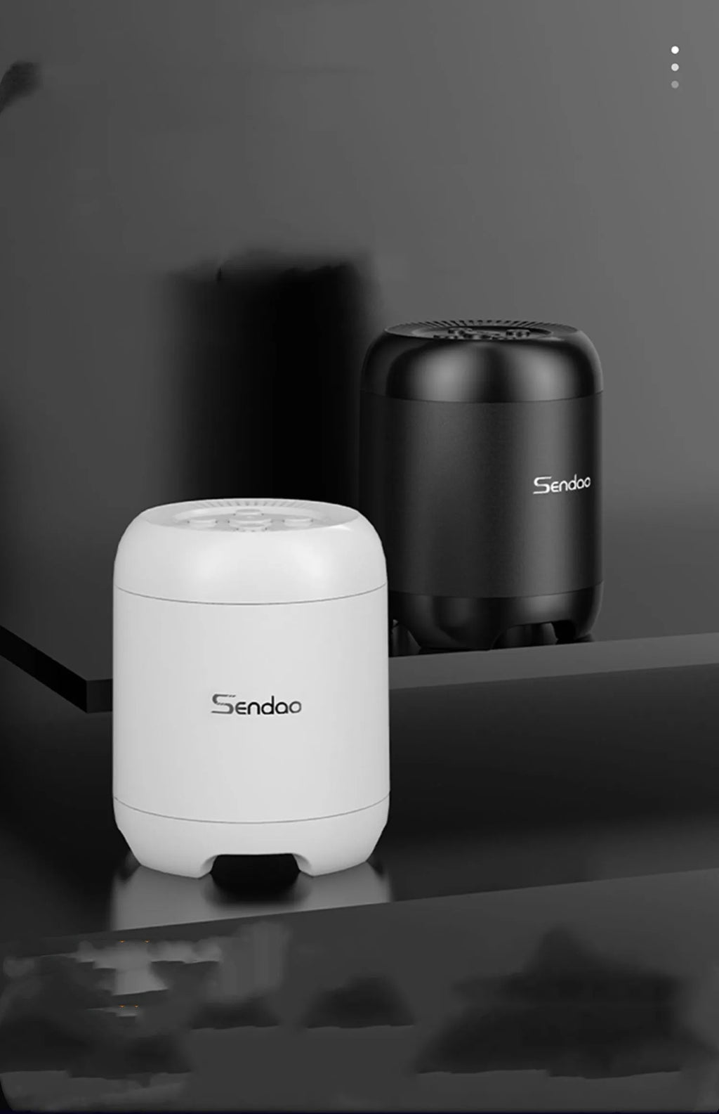 Compact black or white wireless Bluetooth speaker with card reader slot and USB port