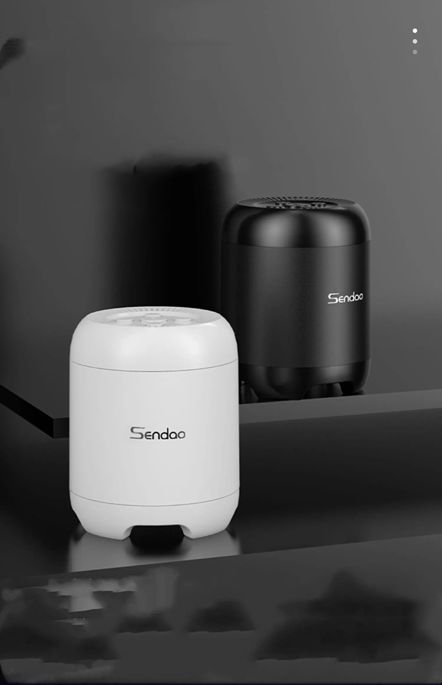 Compact black or white wireless Bluetooth speaker with card reader slot and USB port