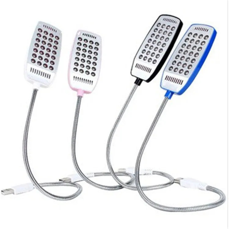 Black flexible gooseneck USB LED lamp bent over a book.