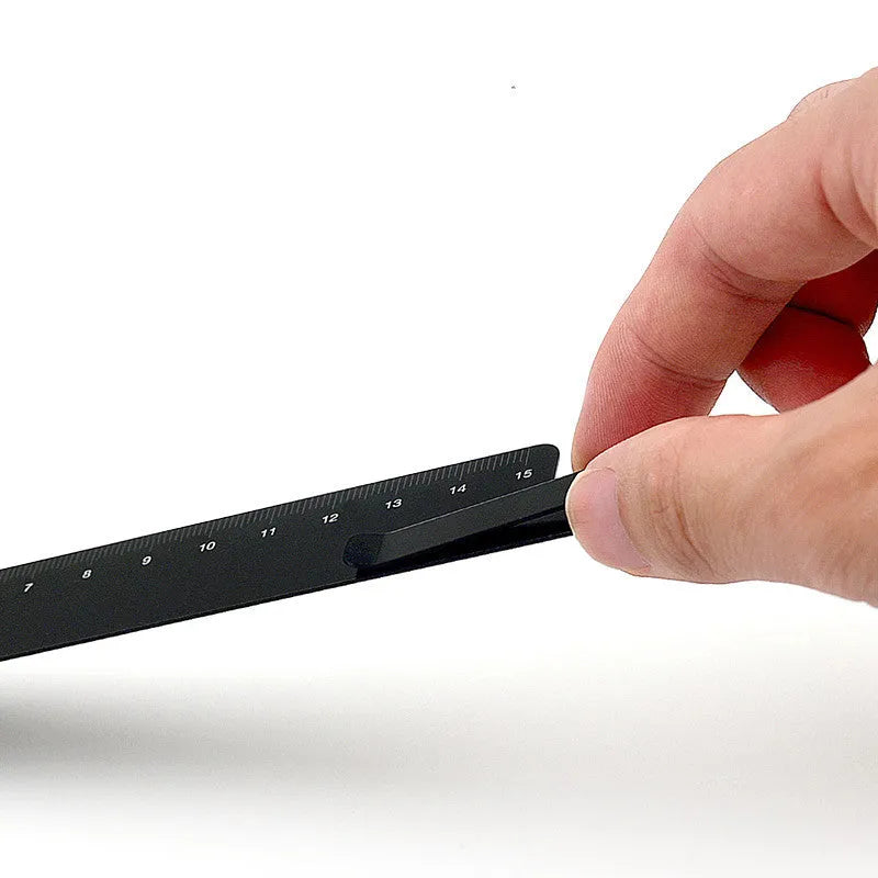 RUMA aluminium bookmark ruler showing 15cm laser-engraved scale in black finish