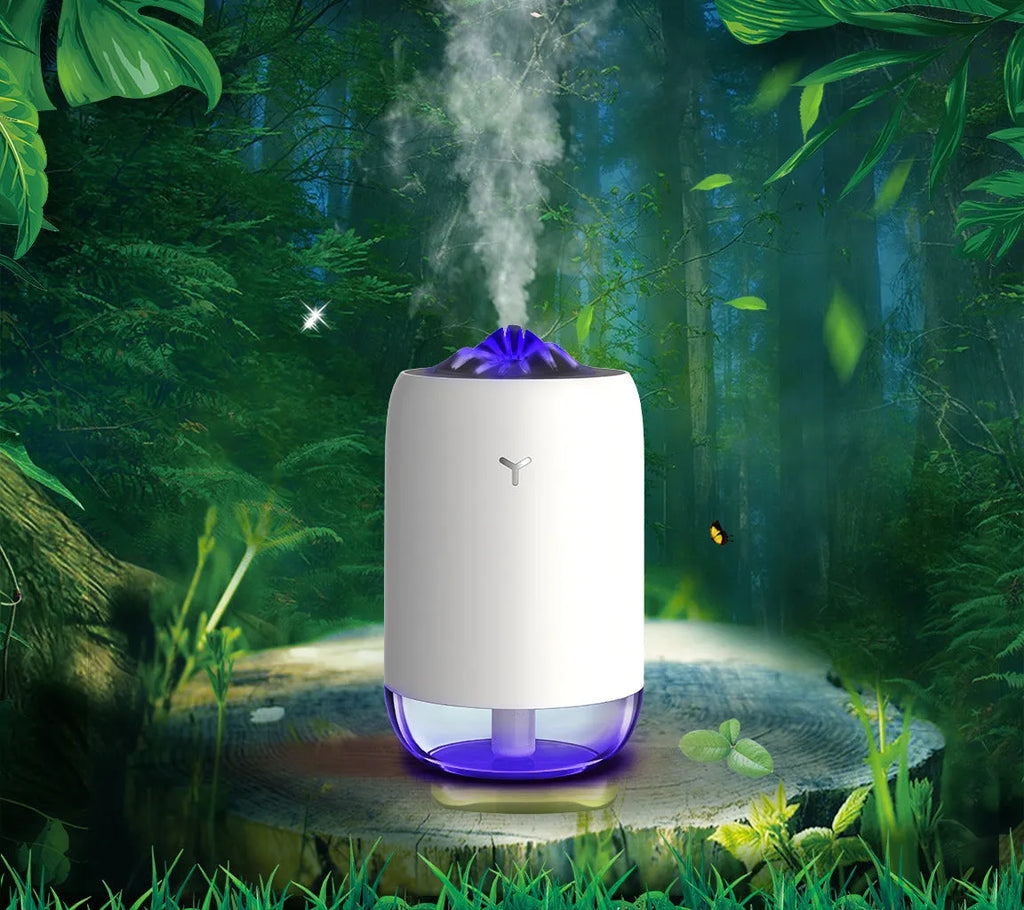 White columnar Magic Flame ultrasonic humidifier with USB cable on a wooden desk.