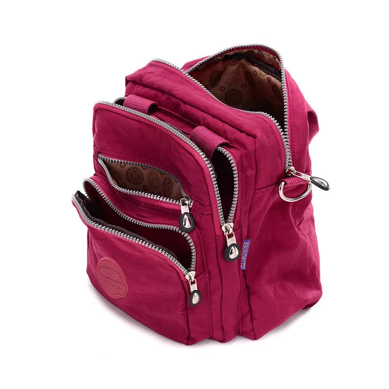Ladies waterproof nylon cross-body shoulder bag, 25cm high, 24cm long, 12cm thick, in dark blue, black and beige.
