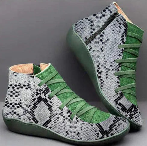 Women's casual black PU booties with a round toe and flat wedge heel on a rubber sole.