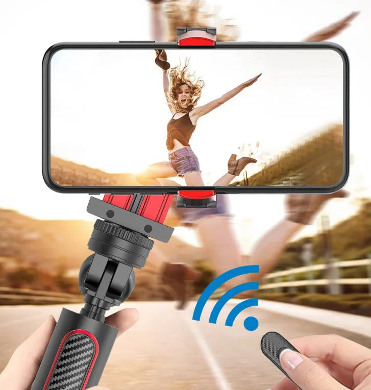 Black aluminium video stabiliser tripod extended to full height with an iPhone securely clamped.
