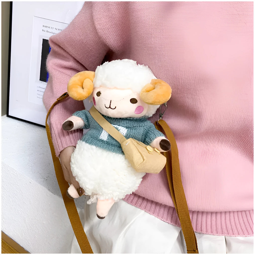 Small blue plush crossbody bag with square design, zip opening, and lamb pattern