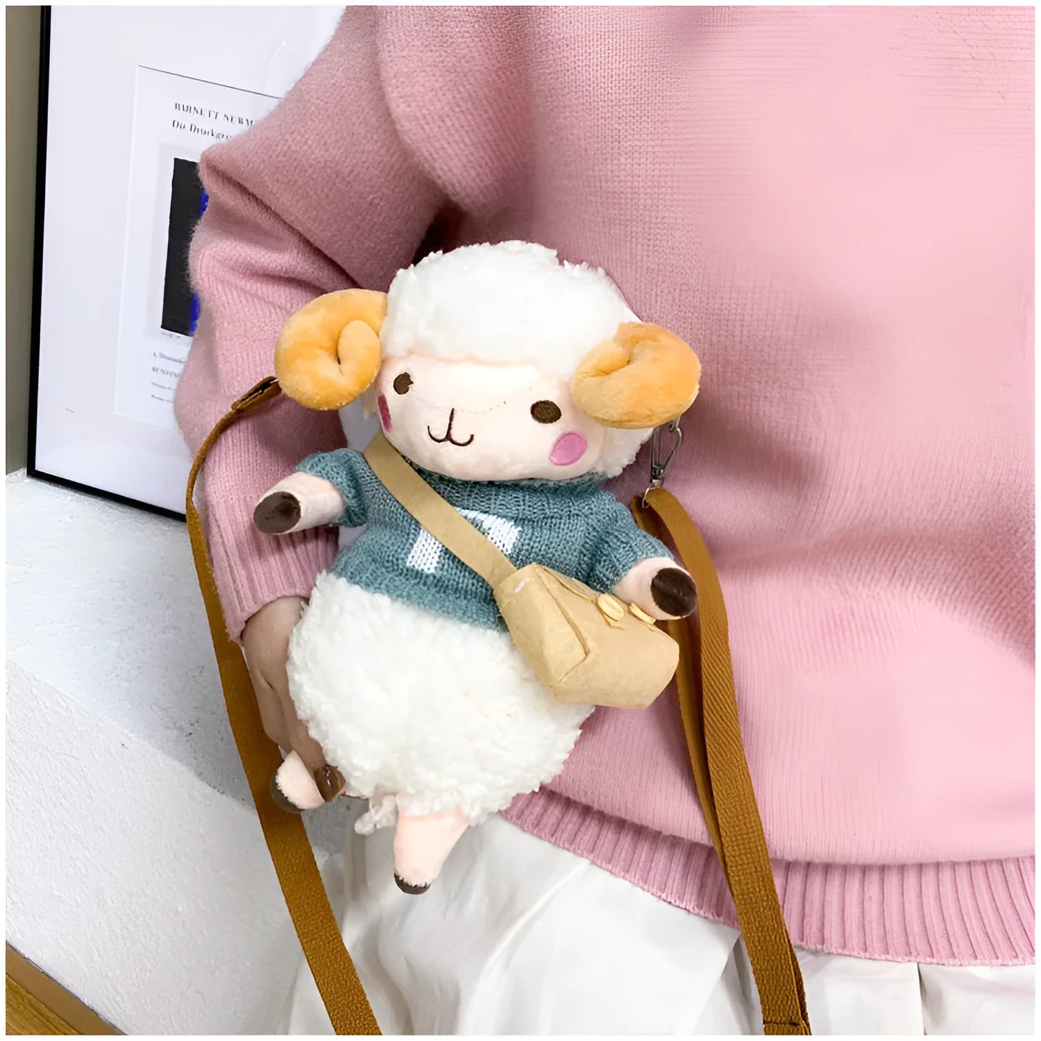 Small blue plush crossbody bag with square design, zip opening, and lamb pattern