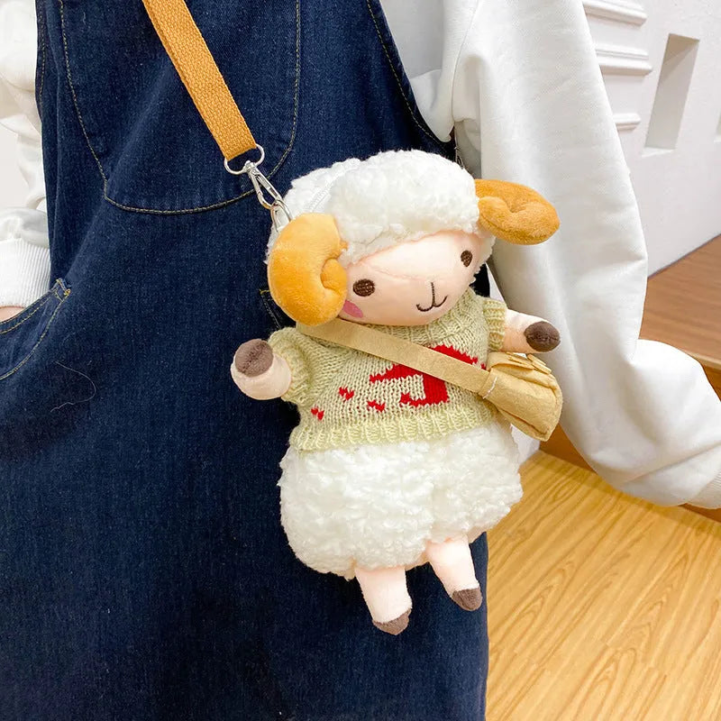 Small blue plush crossbody bag with square design, zip opening, and lamb pattern