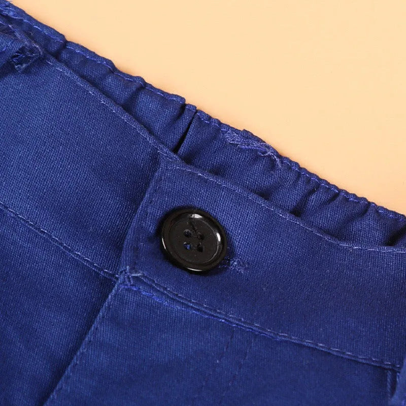 Blue boys' smart clothing set featuring a turtleneck, vest, trousers, and tie on a hanger