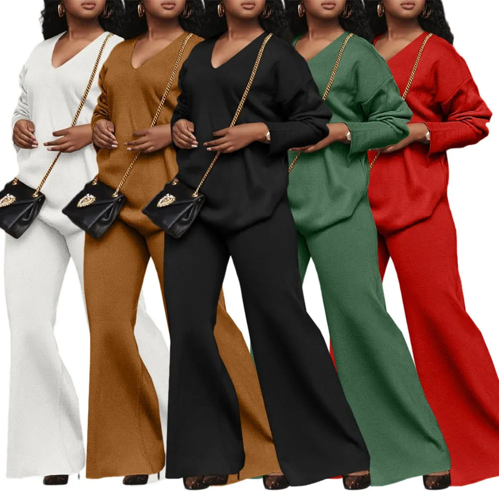 Brown women's long-sleeve suede top and trousers two-piece casual suit on a hanger.
