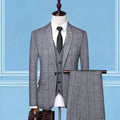 Men's three-piece checkered suit in cotton-blend viscose with single one-button placket, shown in blue, black, grey and beige