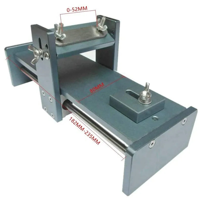 Aluminium fixed angle sharpening tool for woodworking chisels and planers on a workbench.