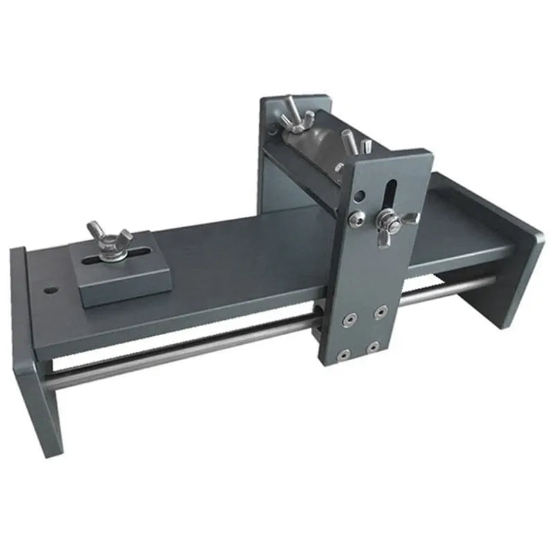 Aluminium fixed angle sharpening tool for woodworking chisels and planers on a workbench.