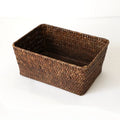 Woven straw desktop storage box in natural colours with pens and cosmetics inside