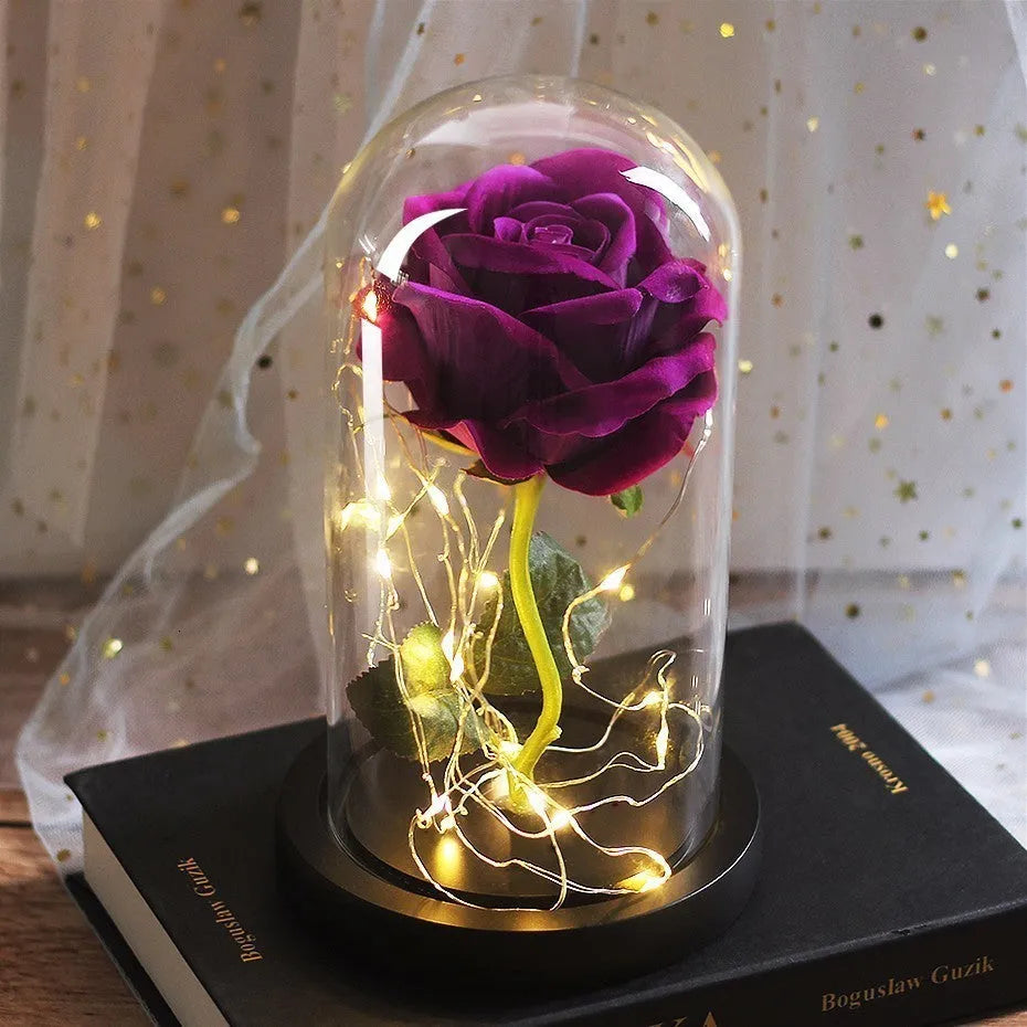 Artificial rose bouquet in glass dome with LED light on solid wood base