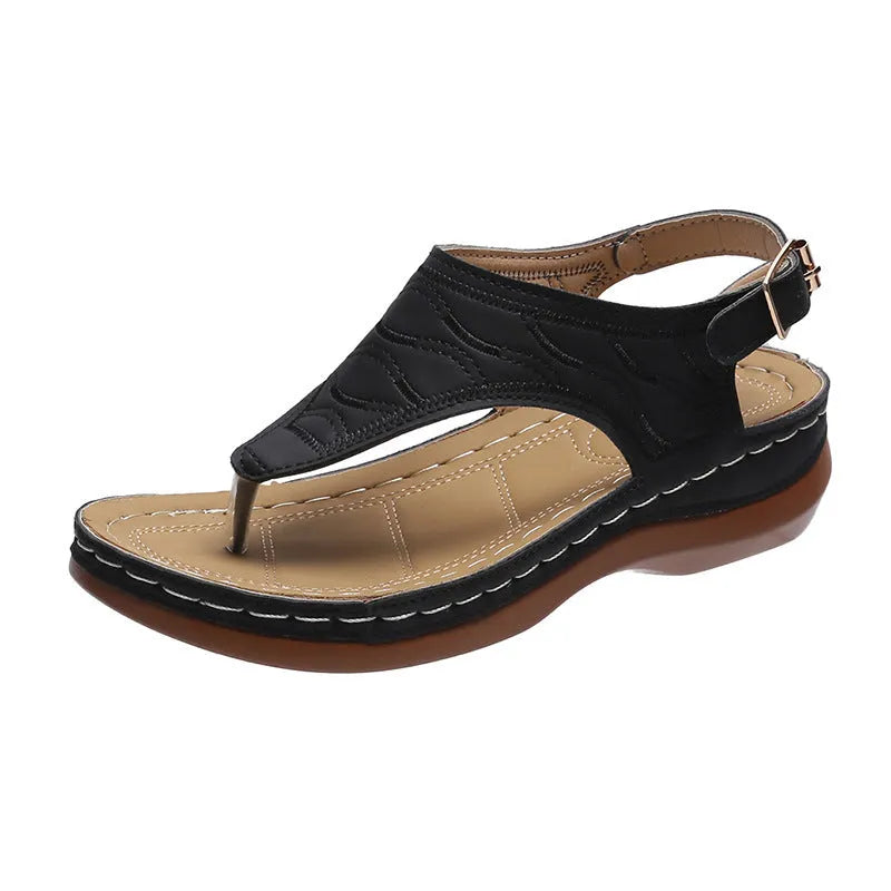 Women's casual wedge heel flip flop sandals with an adjustable buckle strap in solid colours.