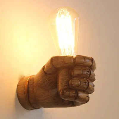 Creative Fist Wall Lamp resin construction in black finish for commercial corridor lighting
