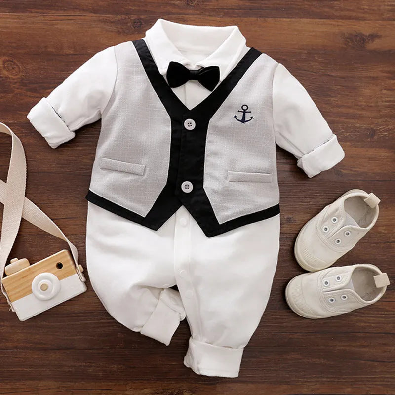 Baby jumpsuit in cotton fabric, long sleeves, shown in navy blue gentleman style.
