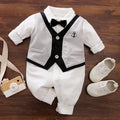 Baby jumpsuit in cotton fabric, long sleeves, shown in navy blue gentleman style.