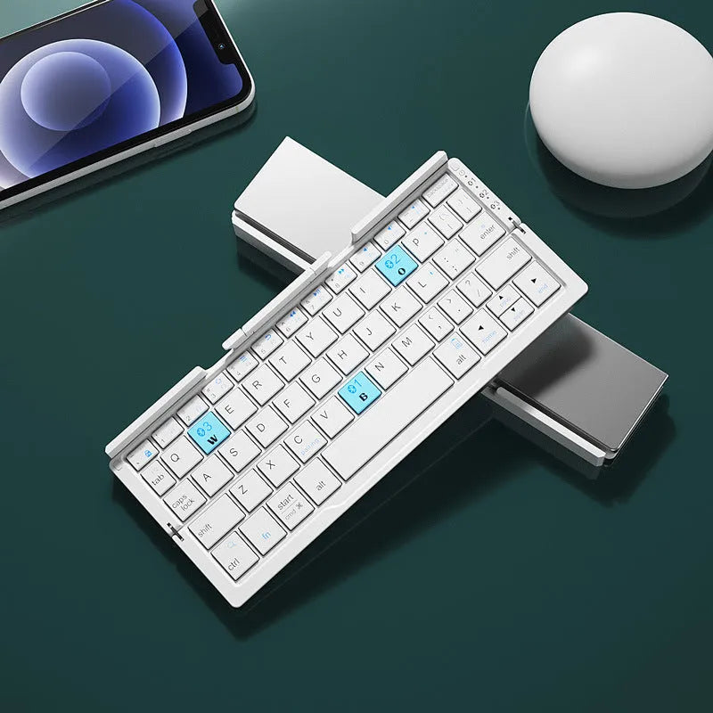 Silver aluminium folding Bluetooth keyboard with stand holding smartphone