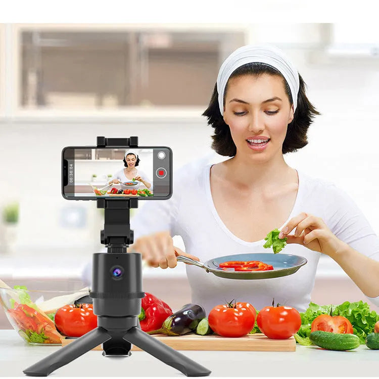 360-degree rotating AI tracking smartphone bracket on a desk for hands-free filming.