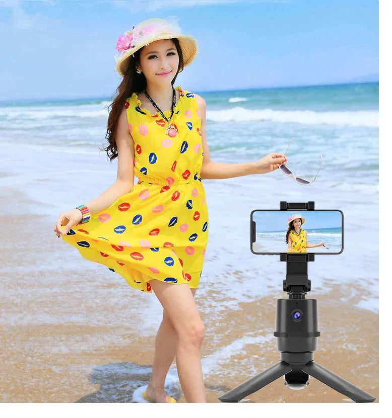 360-degree rotating AI tracking smartphone bracket on a desk for hands-free filming.