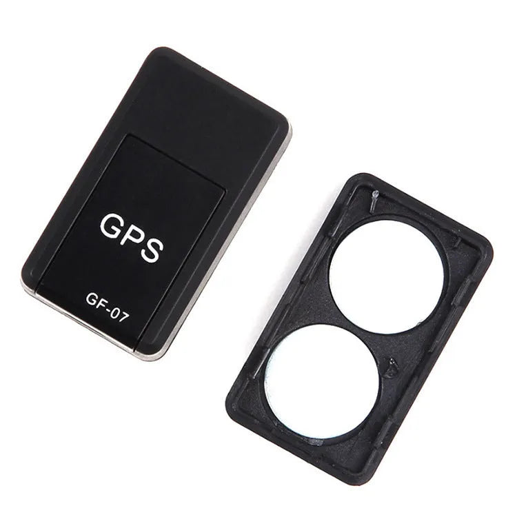 Small black magnetic GPS car tracker device with USB charging cable.