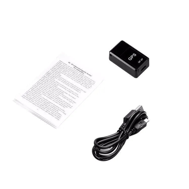 Small black magnetic GPS car tracker device with USB charging cable.