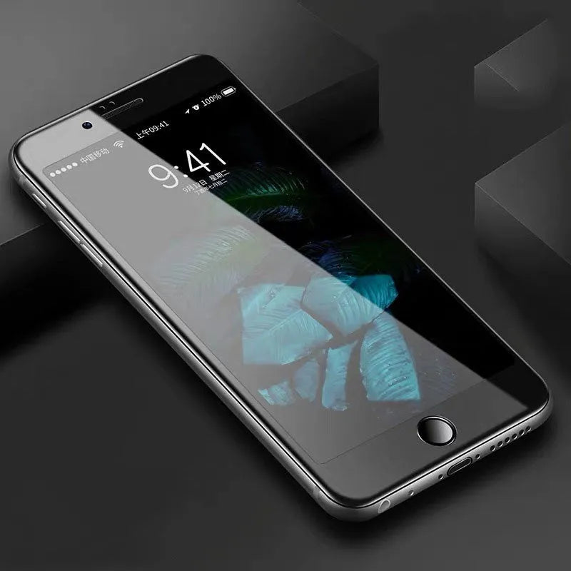 Three-pack of black and white tempered glass screen protectors for iPhone models on a clean surface.