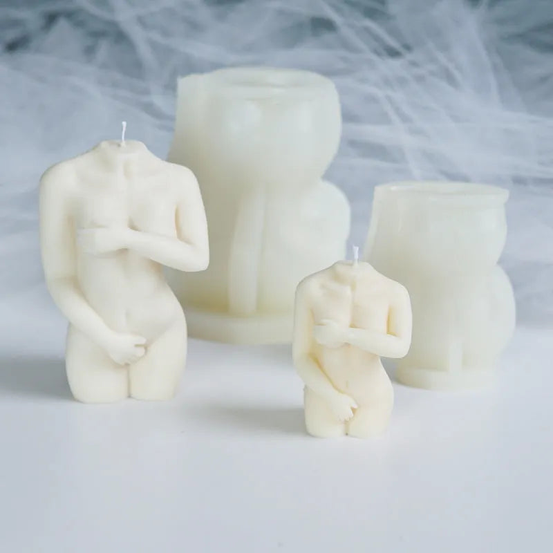 Silicone mould for making detailed shy female body shaped candles in three different poses.