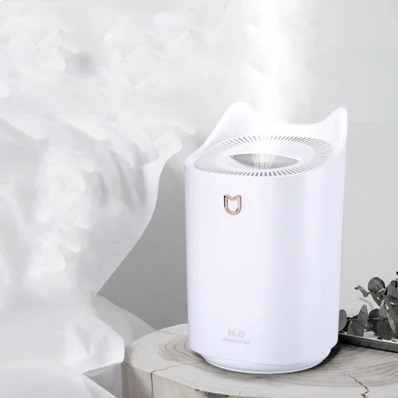 Double spray humidifier with USB cable and three mist outlets in coral pink or white for bedroom use.