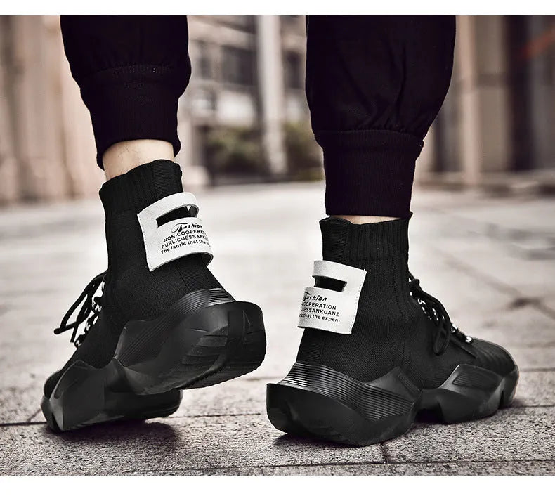 Men's black and white casual sports shoes with mesh lining, shown in large sizes