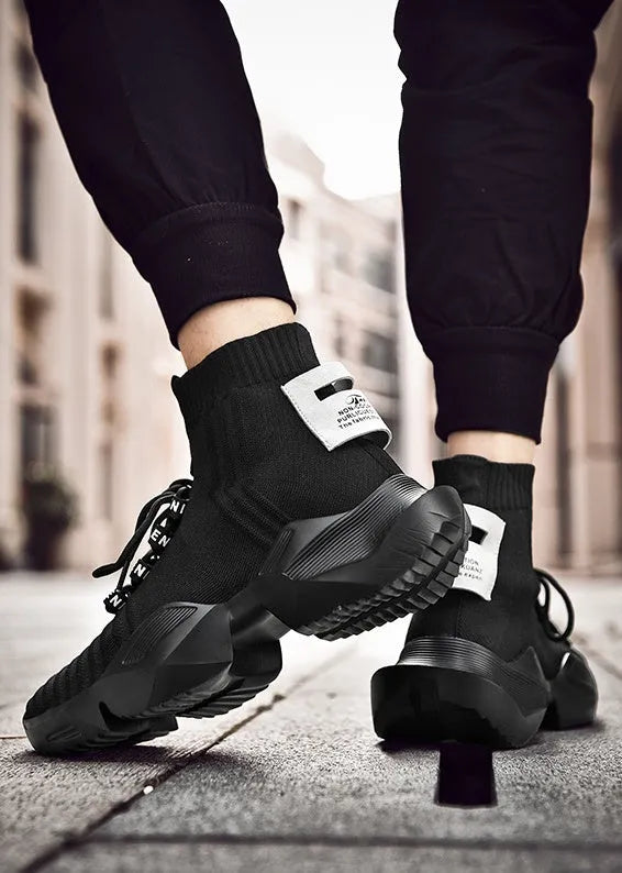 Men's black and white casual sports shoes with mesh lining, shown in large sizes