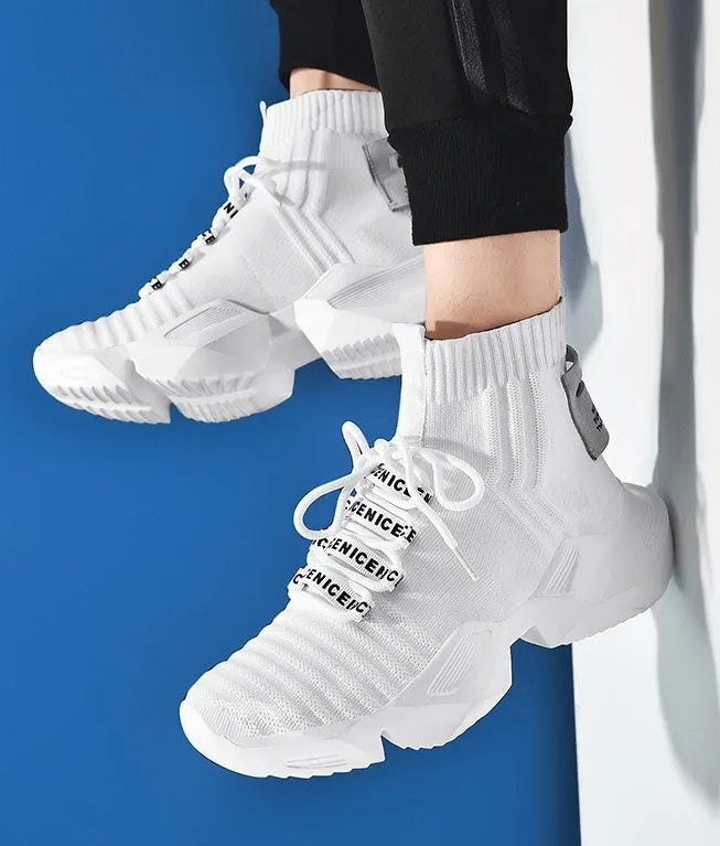 Men's black and white casual sports shoes with mesh lining, shown in large sizes