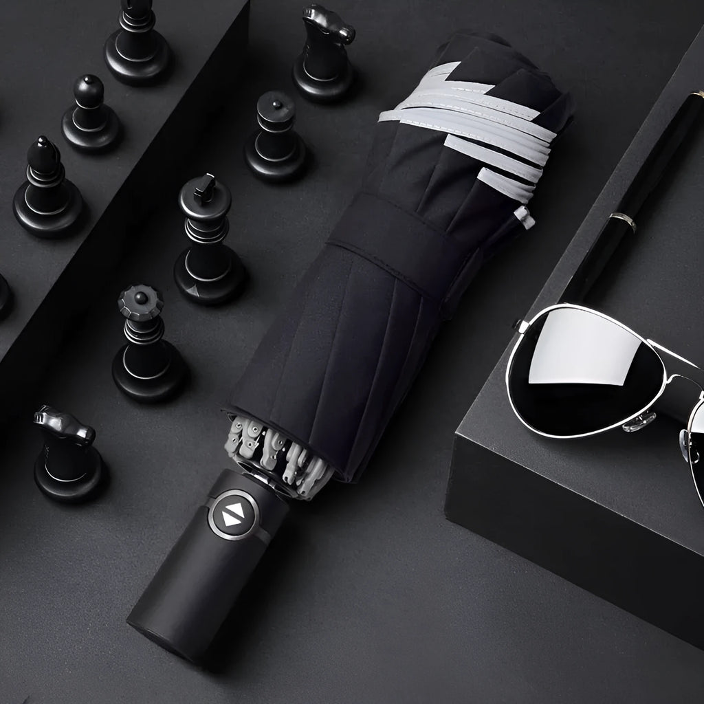 Automatic reverse umbrella with black canopy showing reverse closing mechanism and plastic handle