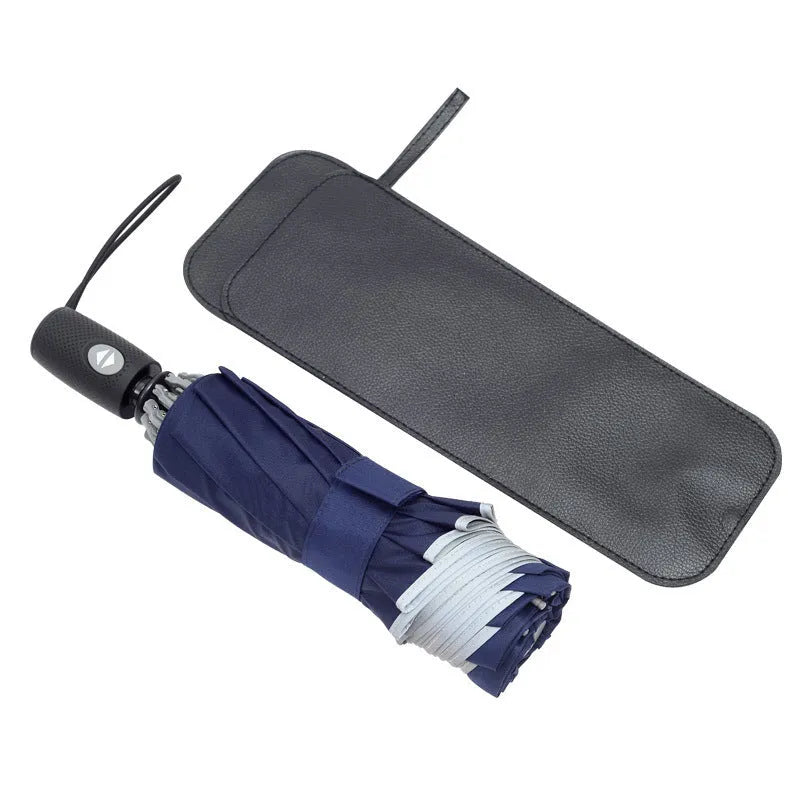 Automatic reverse umbrella with black canopy showing reverse closing mechanism and plastic handle