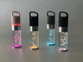 Compact rectangular Bluetooth speaker with colourful crystal light in black, green, pink, or silver grey.