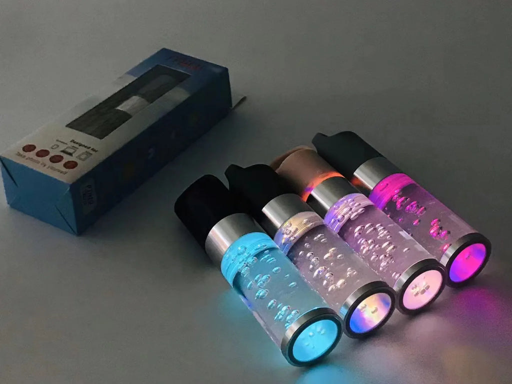 Compact rectangular Bluetooth speaker with colourful crystal light in black, green, pink, or silver grey.