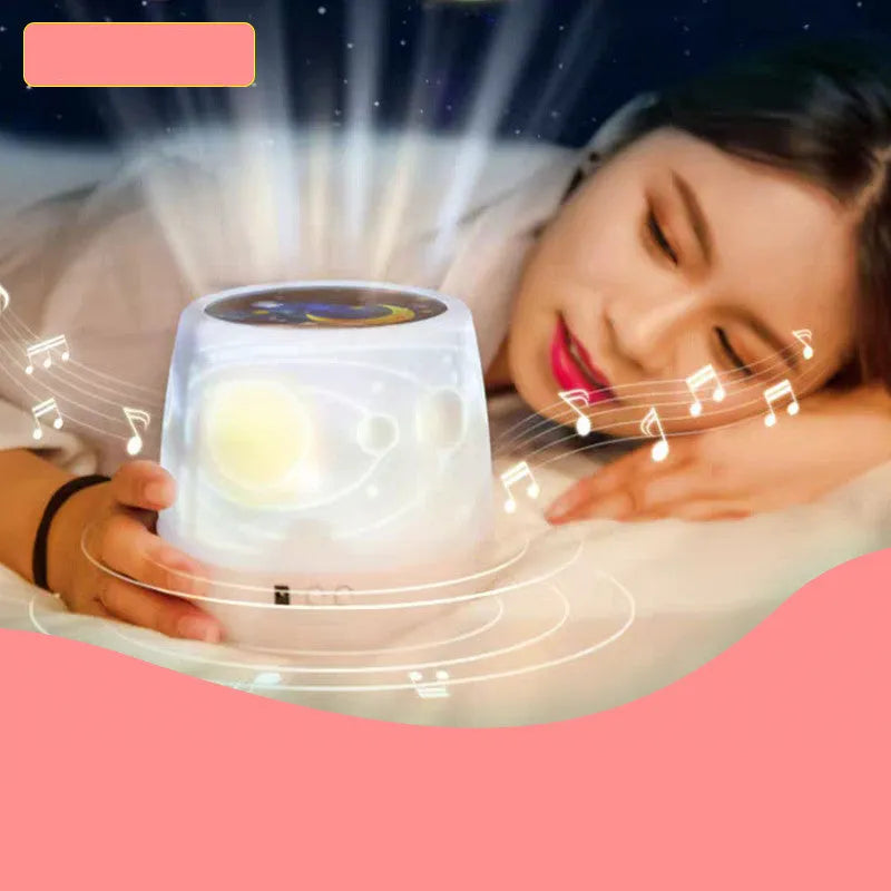 Projector night light projecting rotating starry sky patterns onto bedroom ceiling