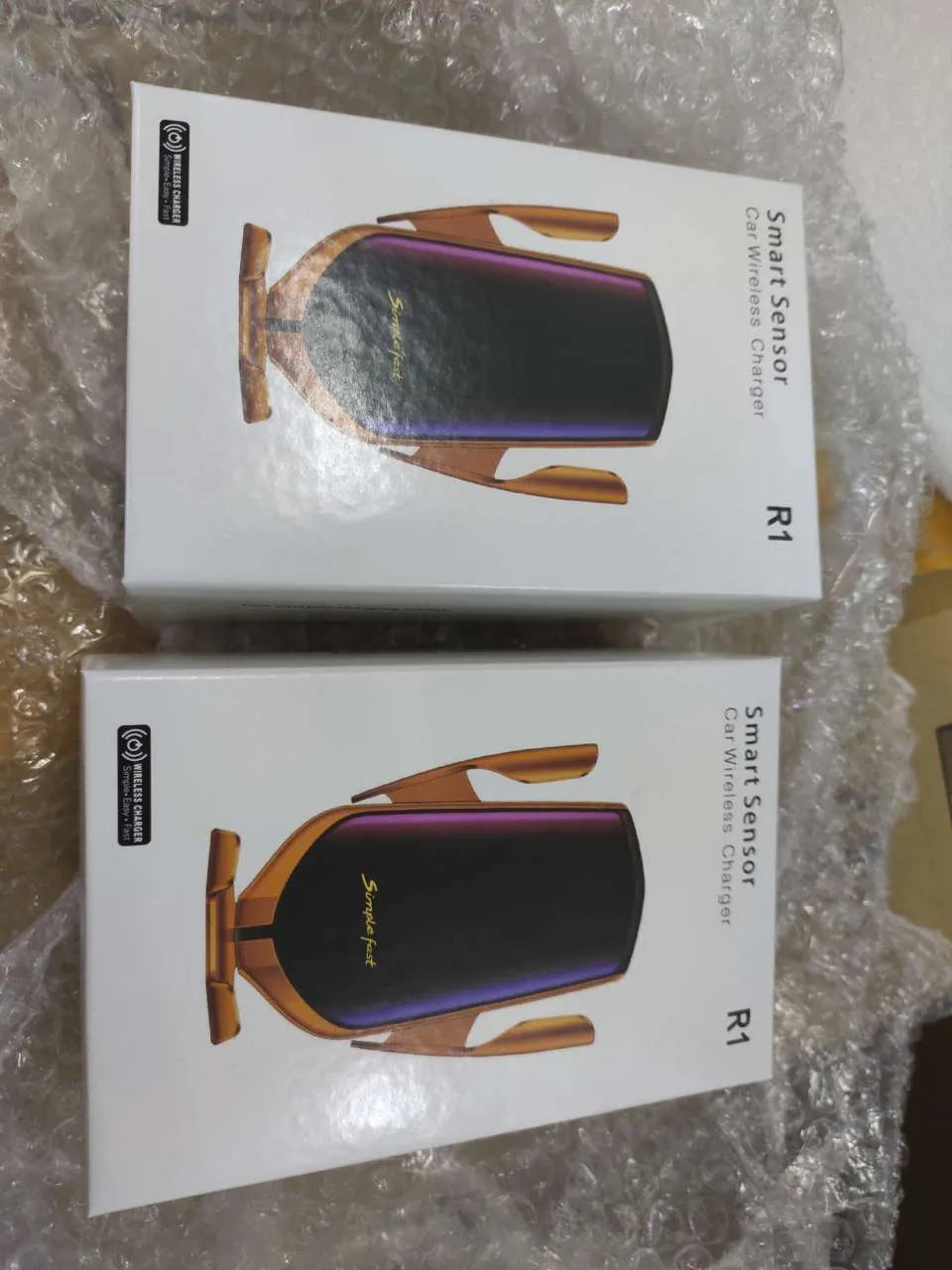 Magic Clip R1 automatic car phone holder with wireless charging in gold or silver mounted in vehicle