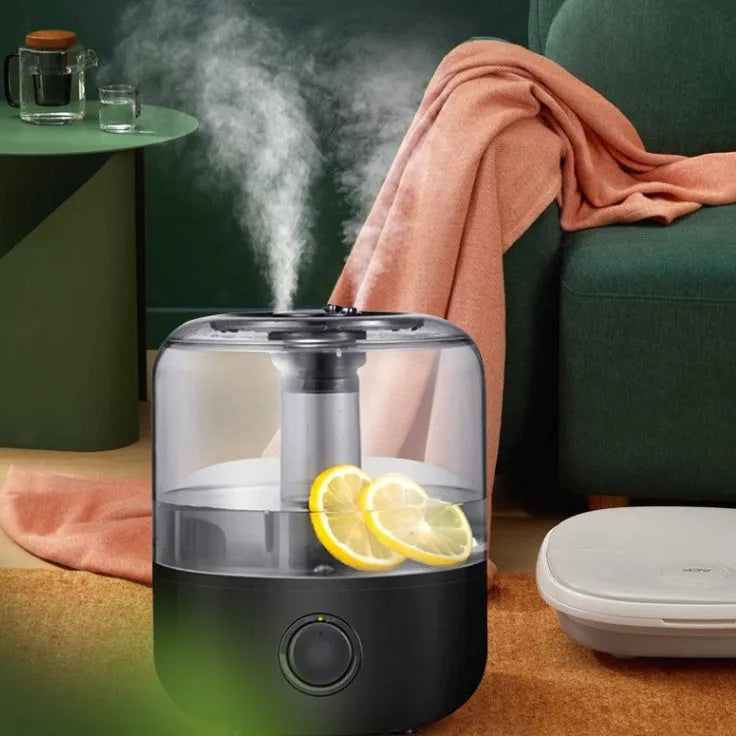 White mechanical humidifier with water tank and control dial on a wooden surface.