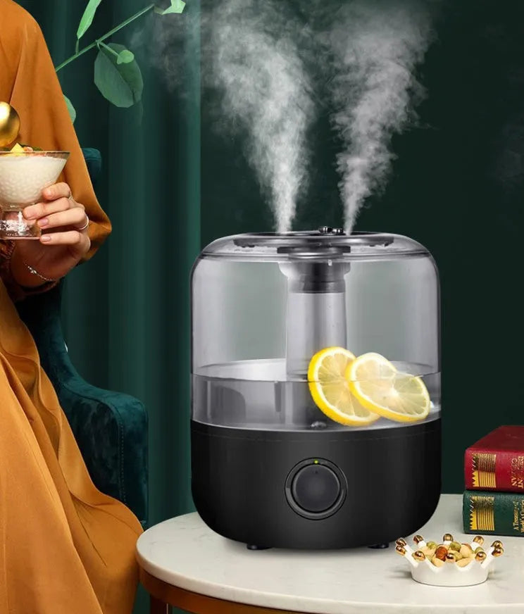 White mechanical humidifier with water tank and control dial on a wooden surface.