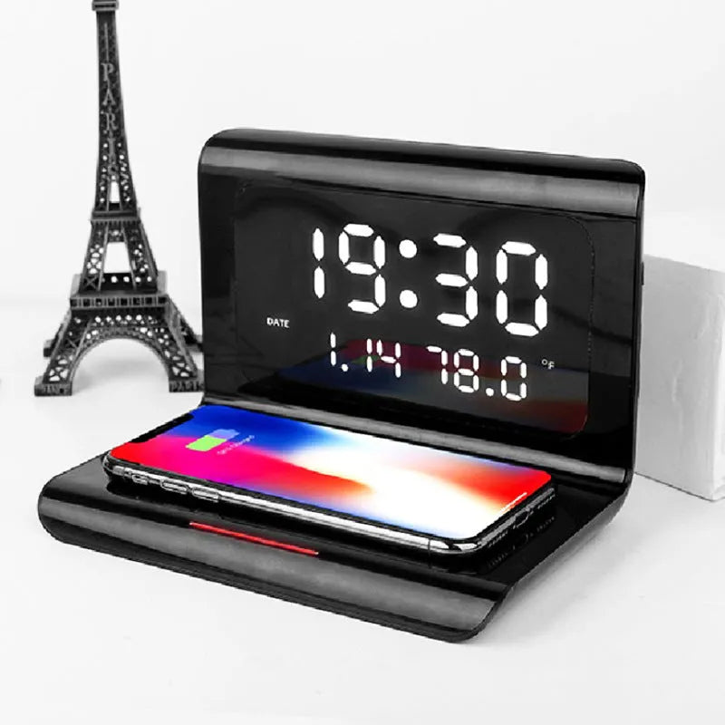 White wireless charger alarm clock showing time, date, temperature and humidity on digital display